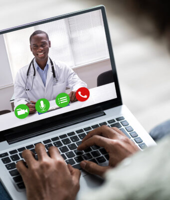COVID Stressing the Nation’s Stress Remedy System photo of man on video conference with doctor