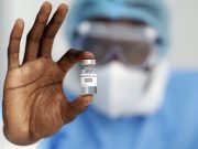 Public Response to Biden Vaccine Push Diversified however Sturdy man holding coronavirus vaccine